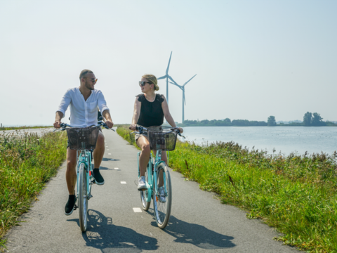 Couple cycling in the summer